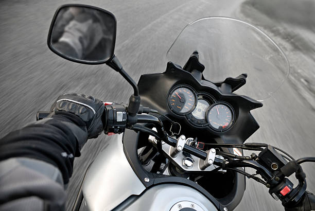 On a touring motorbike during drive.