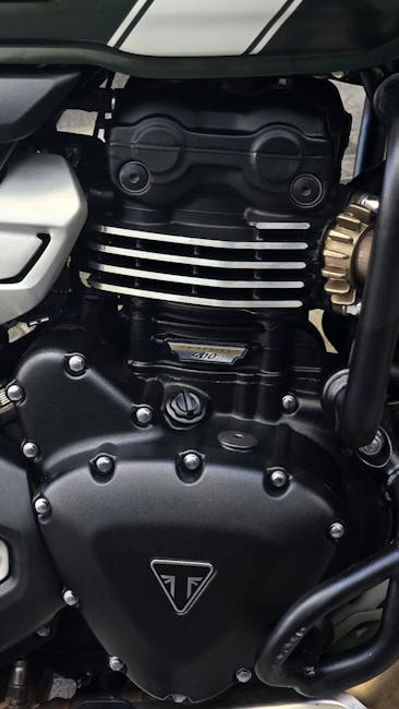 High-resolution close-up of a detailed motorcycle engine showcasing mechanical design.