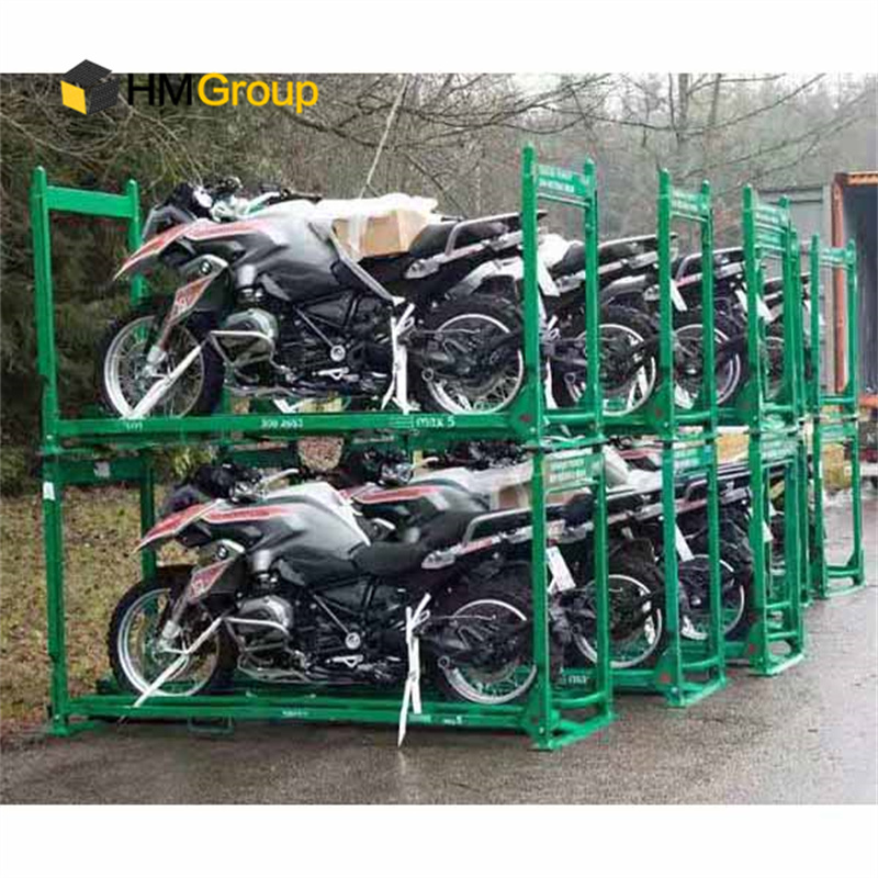 Production line changeover with workers adjusting motorcycle assembly tooling