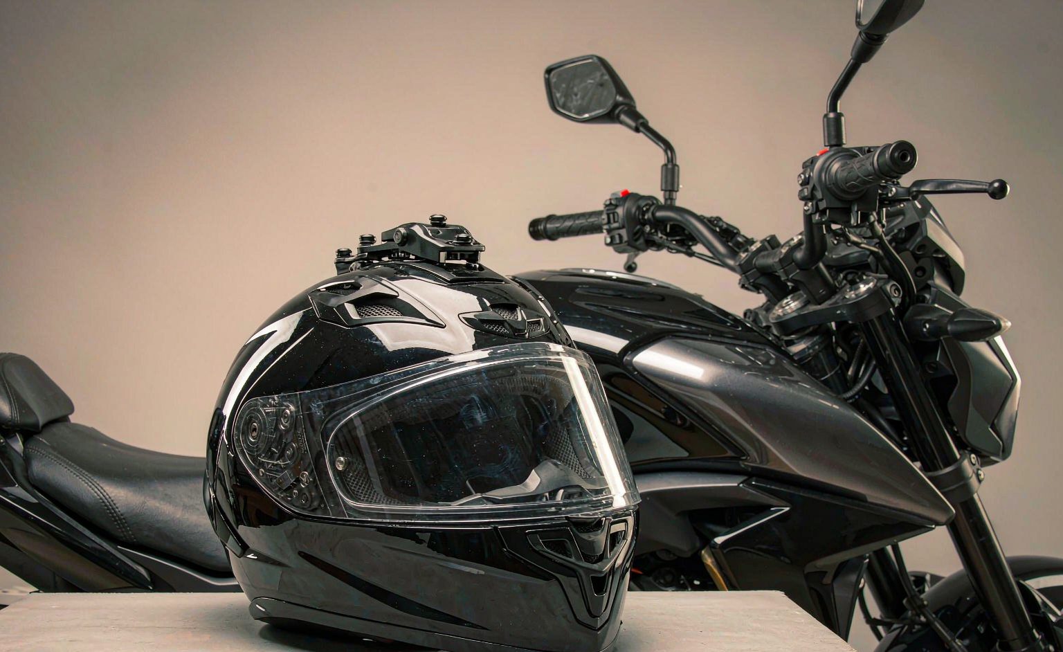 Full-face motorcycle helmet displayed with certification label visible